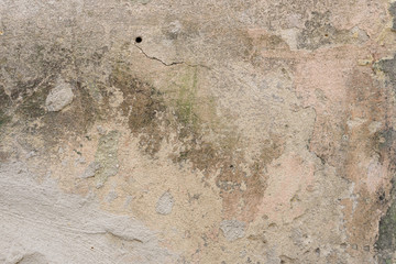 Wall fragment with scratches and cracks