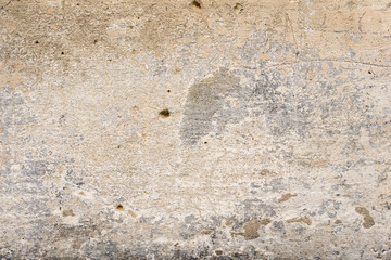 Wall fragment with scratches and cracks