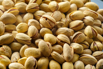 Pistachio nuts. A close-up photograph. Unrefined whole kernel 
