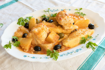 Cod with tomatoes and polenta