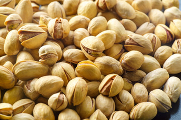 Pistachio nuts. A close-up photograph. Unrefined whole kernel 