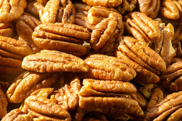Pecans nuts. A close-up photograph. Unrefined whole kernel