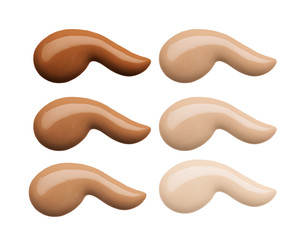 Foundation face makeup samples. Set of cosmetic liquid foundation or cream in different colour smudge smear strokes. Make up smears isolated on a white background. Foundation colors palette