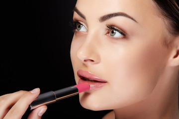 Fototapeta premium Closeup of girl with lipstick