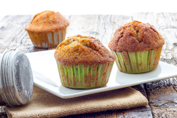 Muffins on a wooden table