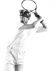 Male tennis player with racket in action.