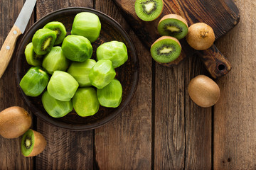 Kiwi fruit on wooden rustic table, ingredient for detox smoothie