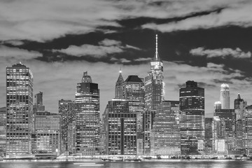 Black and white picture of the Manhattan at night, New York City, USA.