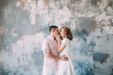 A guy with a girl in the studio. Merry photosession.