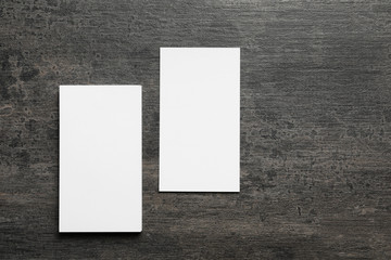 Blank business cards on grey background