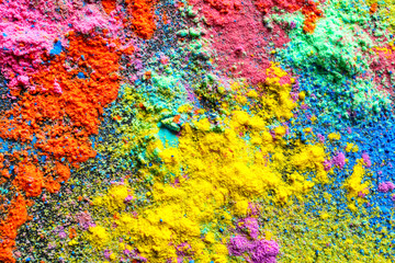 Fototapeta na wymiar Colorful powders for Holi festival as background