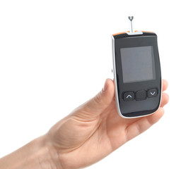 Woman holding digital glucometer on white background. Diabetes concept