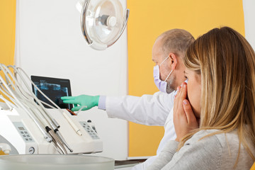 Fototapeta premium Nervous patient at the dentist office