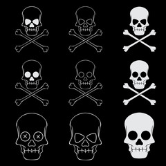 Cross bones skulls set on black background. Symbol of danger and death. 