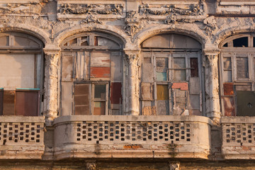 Detail of an old house with balcony and tapped windows in havana, Cuba