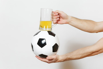 Male hands horizontal holding soccer classic white black ball, pint mug of beer isolated on white background. Sport, play football, health, healthy lifestyle concept.