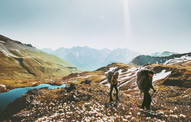 Couple backpackers hiking together in mountains adventure travel lifestyle wanderlust concept...