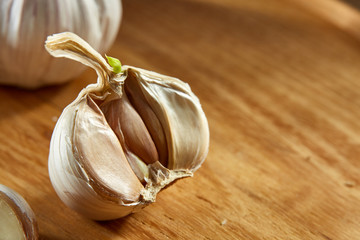 Garlic close up on rustic wooden background, shallow depth of field, selective focus, macro