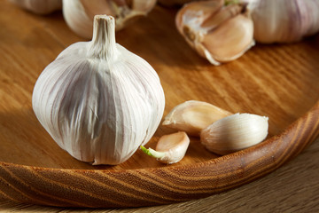 Garlic close up on rustic wooden background, shallow depth of field, selective focus, macro