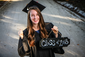 Girl Graduating High School with Cap Gown