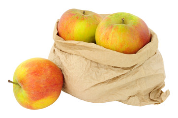 Fresh apples in an environmentally friendly brown paper bag isolated on a white background