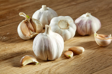 Garlic close up on rustic wooden background, shallow depth of field, selective focus, macro