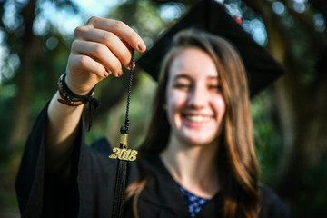 Girl Graduating High School with Cap Gown