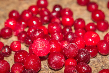 Cold frozen red berry cranberries on the table