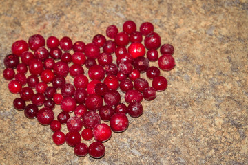 Cold frozen red berry cranberries on the table