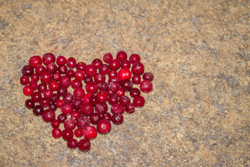 Cold frozen red berry cranberries on the table