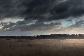 Storm Clouds above a field and forest