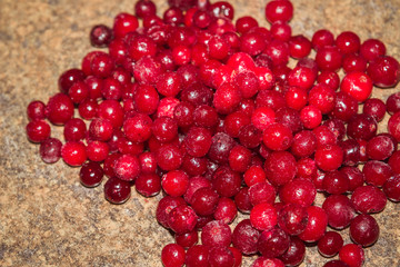 Cold frozen red berry cranberries on the table