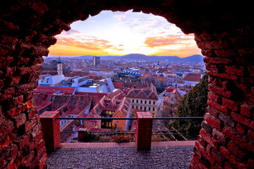 Graz city center and Mur river aerial burning sunset view