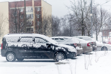 Parked cars after winter blizzard