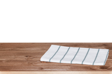 Empty wooden deck table with tablecloth for product montage. Free space for your text