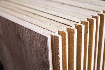 Samples of laminate and parquet board. Selection and types of floor coverings.