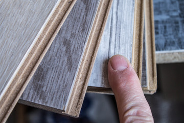 Samples of laminate and parquet board. Selection and types of floor coverings.