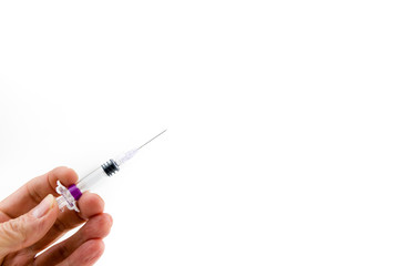 Syringe needle with influenza vaccine or medicine in doctors hands isolated on white background copy space