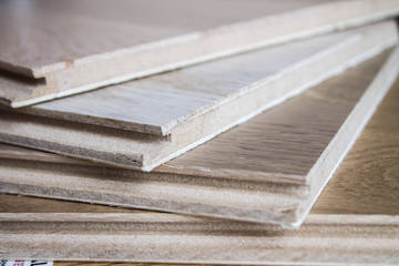 Samples of laminate and parquet board. Selection and types of floor coverings.