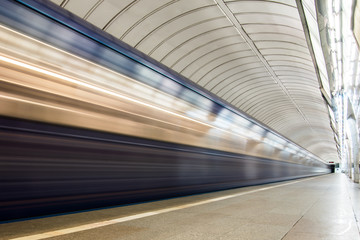 Subway metro train arriving at a station