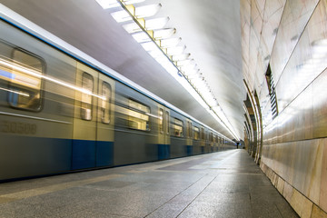 Subway metro train arriving at a station