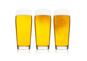 Cold glasses of lager beer with foam and dew