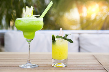 Two Cocktails in Rays Of Sun