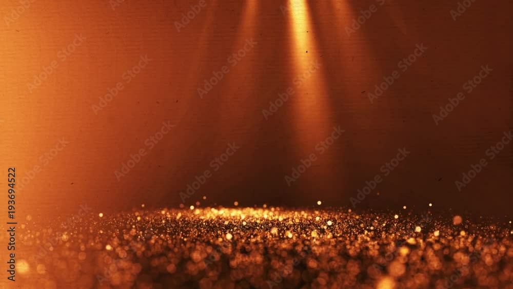 Canvas Prints golden particles glitter in slow motion on a blurred background. 4k uhd seamless loop video.