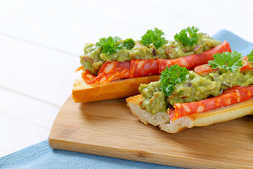 baguettes with salami and guacamole