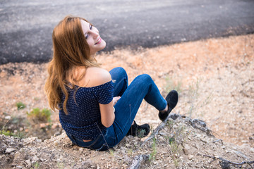 Pretty young blonde girl in outdoors