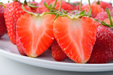 Strawberry on white plate isolated on white background