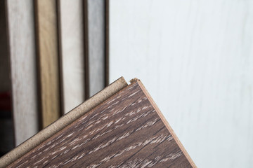 Samples of laminate and parquet board. Selection and types of floor coverings.