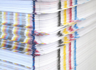 Stack of paper with CMYK