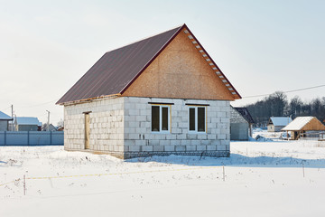 under construction private house of blocks on winter